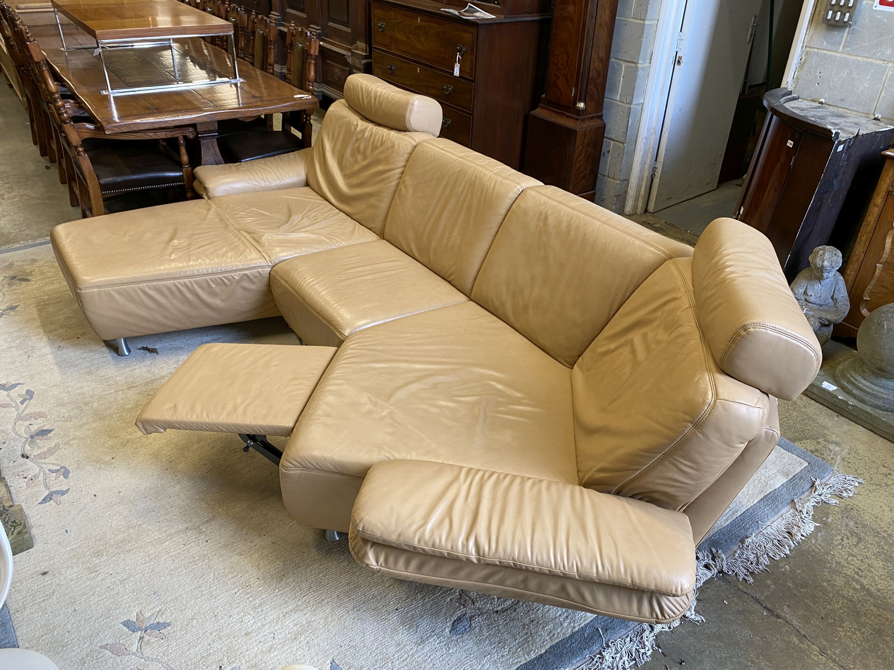 An Italian beige leather curved corner sofa, length 250cm, maximum width 160cm, height 90cm